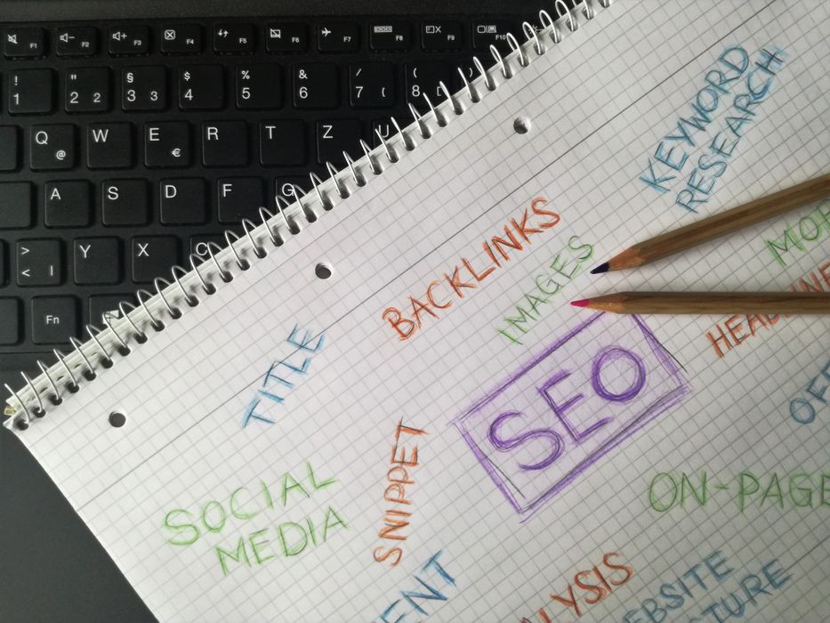 Notebook with SEO keywords and digital marketing notes